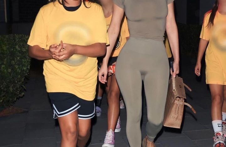 kim-kardashian-sported-an-army-green-skims-look-with-yeezy-slides-and-a-$24k-hermes-crocodile-kelly-handbag-at-north’s-basketball-game-(shop-the-look!)