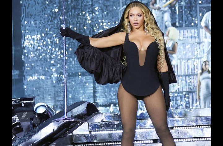 beyonce-channels-her-inner-church-girl-with-a-custom-hooded-carolina-herrera-black-mini-dress